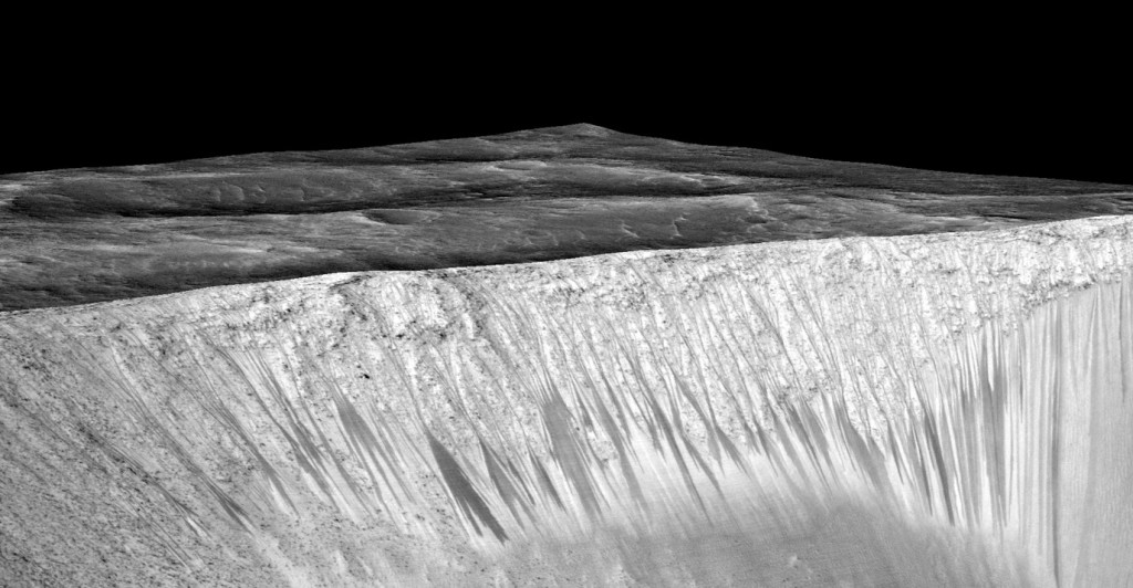 Dark streaks on crater